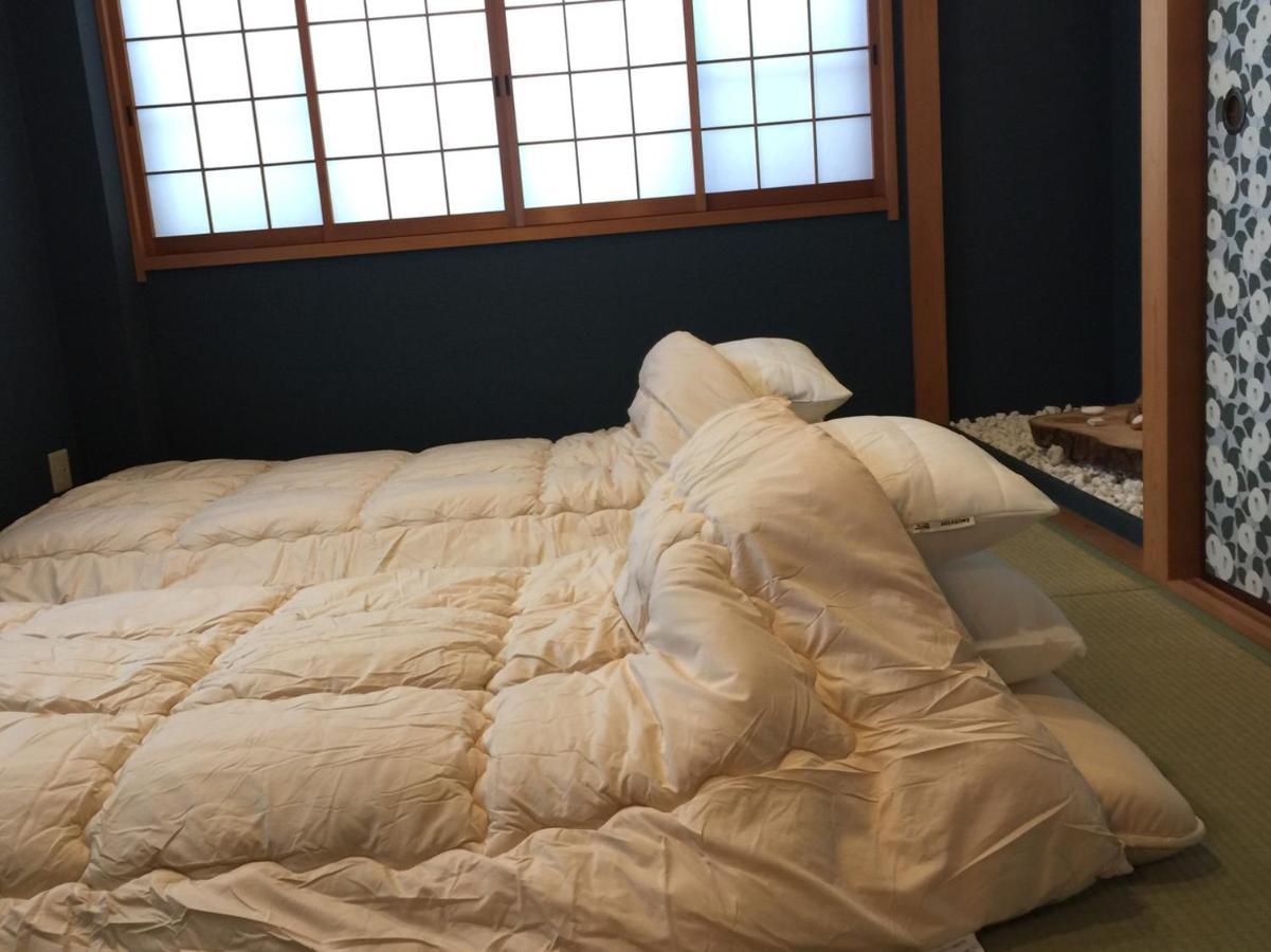 Yumeji Guest House Osaka Bagian luar foto